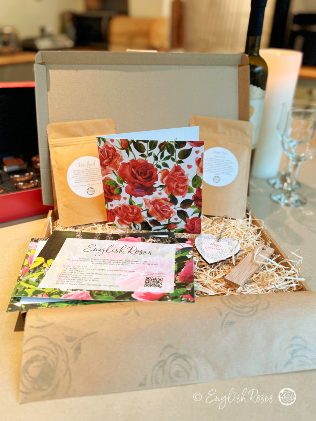 An English Roses Two rose gift box with the greetings card and gift code, wooden tags, help guides and rose feed.