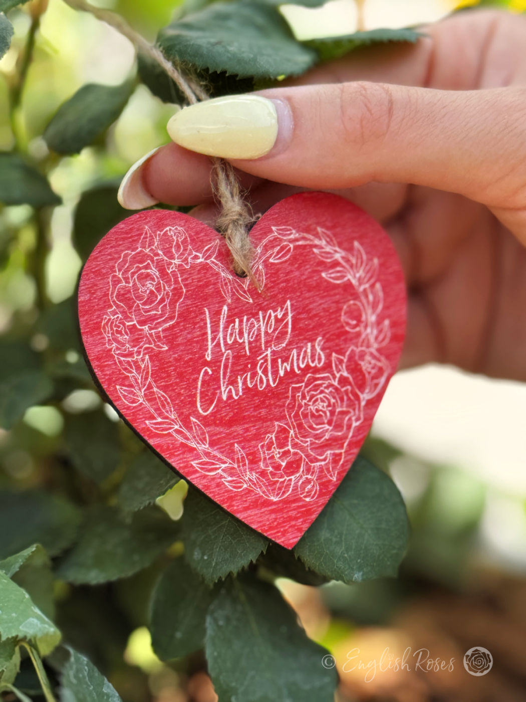 Red and white hanging heart shaped wooden gift tag keepsake saying 'Happy Christmas' - Eco-friendly gift wrap from English Roses