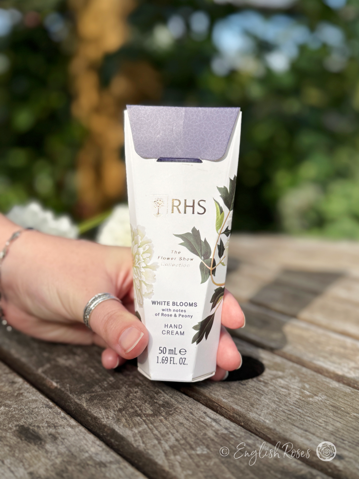 Hand Cream - White Blooms Rose and Peony RHS The Flower Show Collection - A hand holding the decorative hand cream box