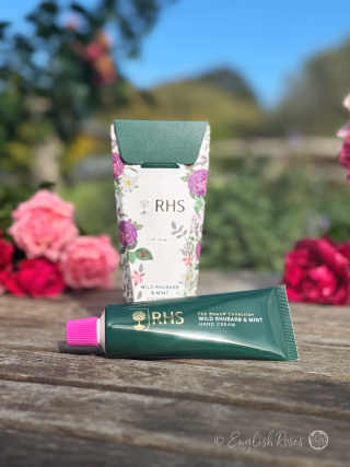 Hand Cream - Wild Rhubarb and Mint RHS The Rewild Collection - A tube of hand cream next to the decorative box