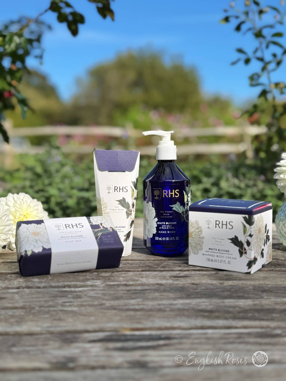 RHS The Flower Show Collection Gardener's Skin Care Range - Close up of the RHS Flower Show Collection White Blooms (Rose and Peony) Gardener's Skin Care - Soap Bar, Hand Cream, Hand Wash and Body Cream.