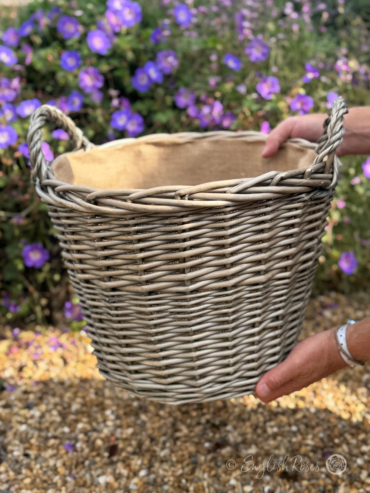 Willow Basket Planters Extra Large XL - An Extra large willow basket planter being held for scale in a sunny garden